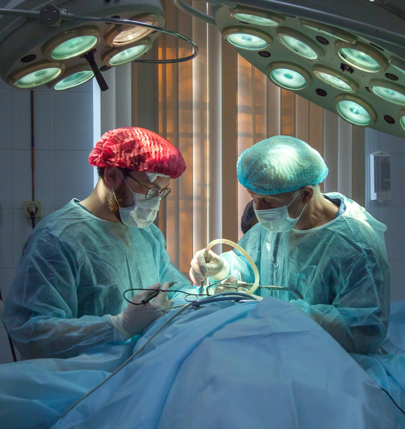 Surgical team working under operating lights